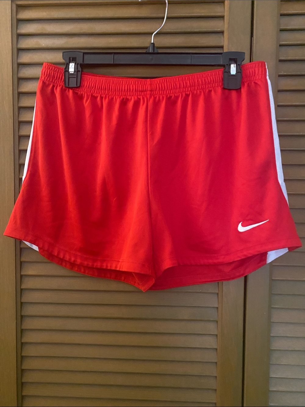 Nike Red Athletic Shorts with White Swoosh